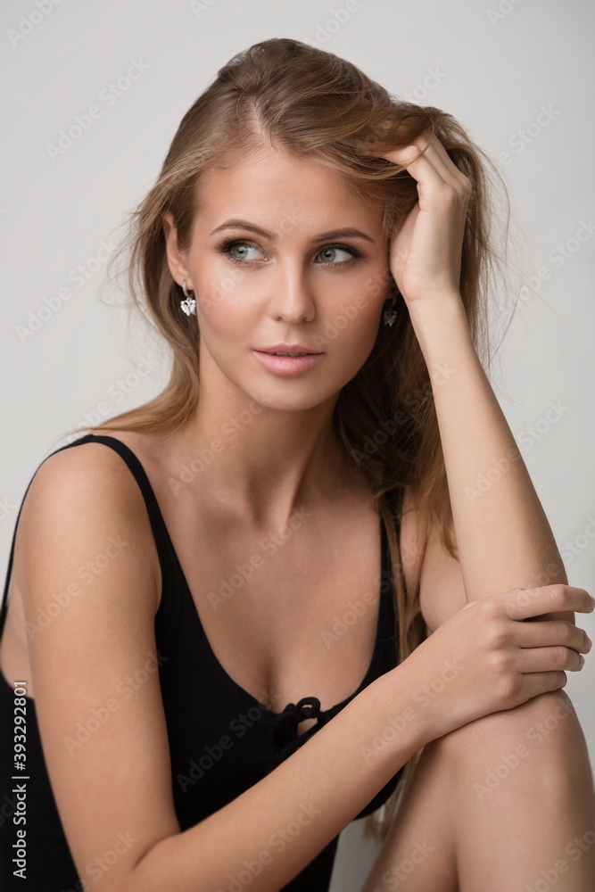beautiful slender blonde girl in black lingerie posing in the studio beautiful slender blonde girl in black lingerie posing in the studio