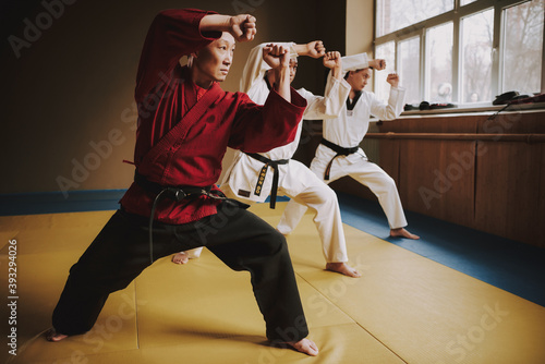 Men stand in attack while practicing techniques.