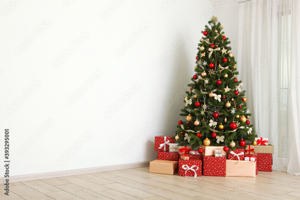 Beautiful interior decorated for Christmas or New Year. Christmas tree and gifts. Place for text