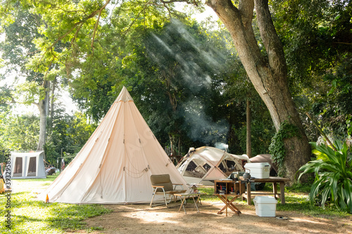 Tela A large white traditional teepee tent with luxurious glamping interiorwith desk