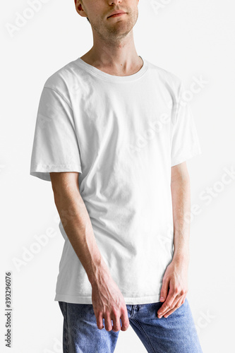 Man in white t-shirt blue jeans studio shot