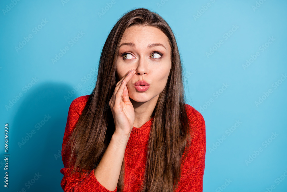 Photo of tricky lady hold hand arm near mouth say gossips look silly empty space wear red knitted sweater isolated blue color background Photo of tricky lady hold hand arm near mouth say gossips look silly empty space wear red knitted sweater isolated blue color background