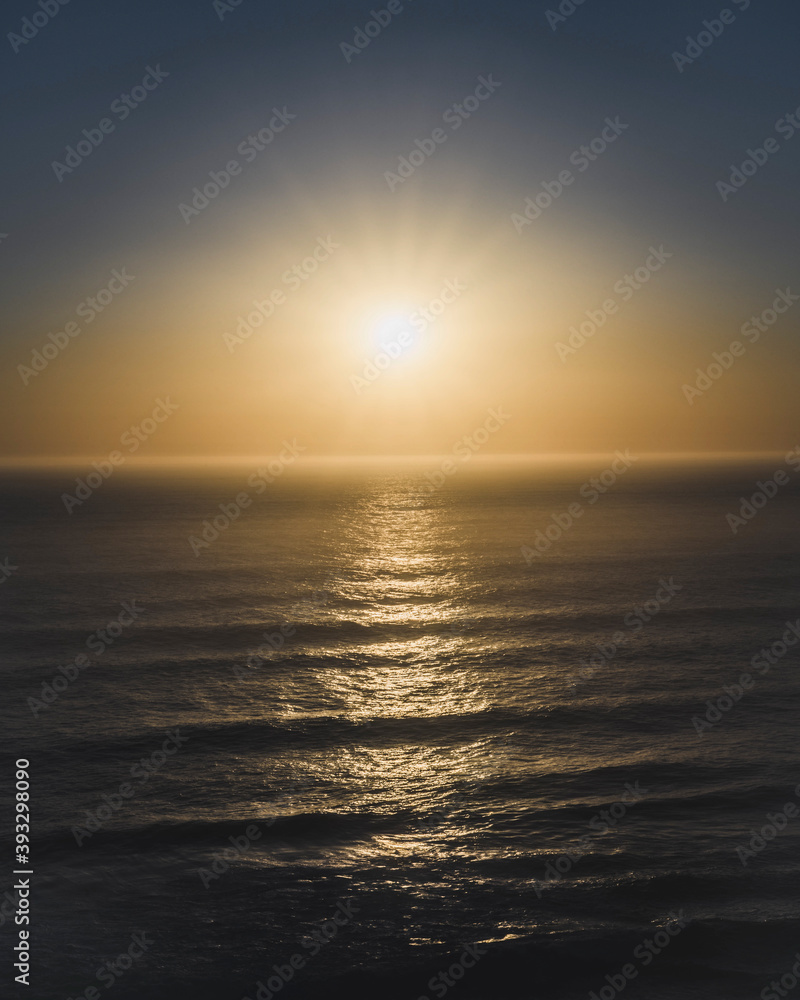 Sun setting over a sea
