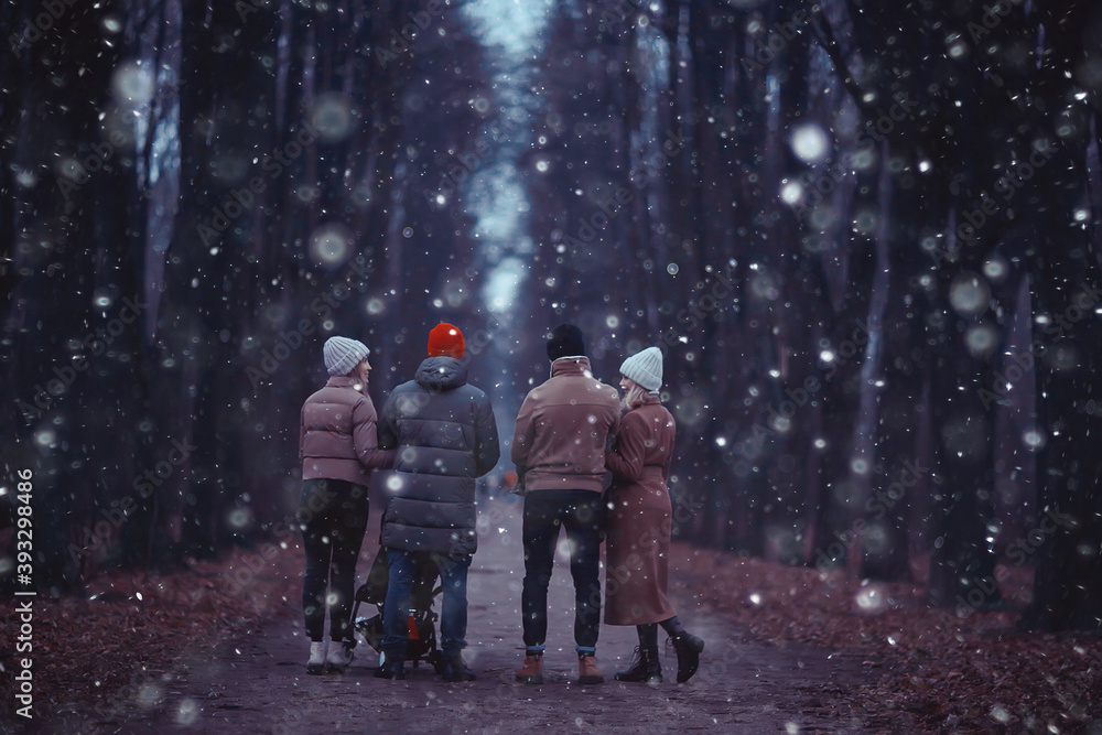 winter walk in the park, young family with a small child and friends, young parents outside seasonal look winter walk in the park, young family with a small child and friends, young parents outside seasonal look