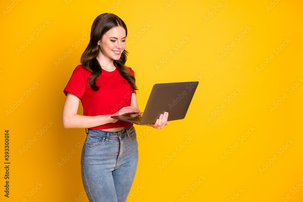 Profile side photo of positive girl work laptop isolated over bright shine color background Profile side photo of positive girl work laptop isolated over bright shine color background