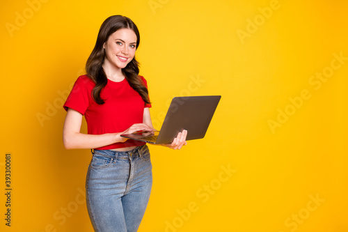Photo of positive girl work laptop enjoy networking coworking isolated over bright shine color background