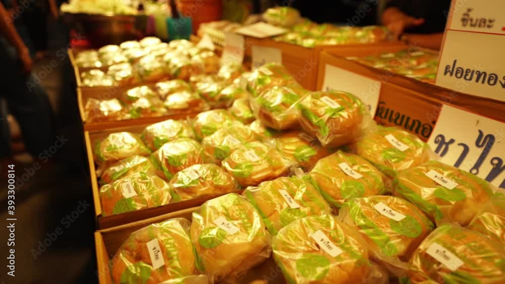 4K Closeup shot of Freshly cooked buns for sale in Chinese walking street, night market in Bangkok, Thailand. baklava. Pistachio baklava. Baklava dessert. Pancakes on a night market in Thailand 4K Closeup shot of Freshly cooked buns for sale in Chinese walking street, night market in Bangkok, Thailand. baklava. Pistachio baklava. Baklava dessert. Pancakes on a night market in Thailand