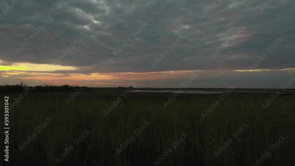 Sunsetting over a marsh near Bridge City, Texas Sunsetting over a marsh near Bridge City, Texas