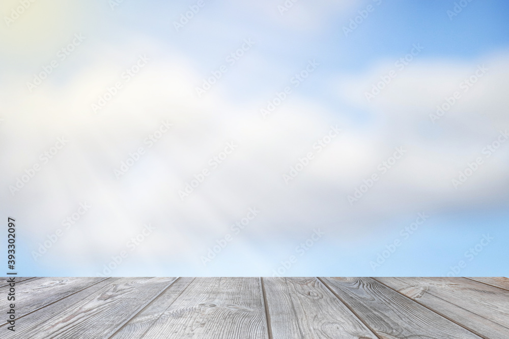 Blurred sky background with sunbeams over the table.