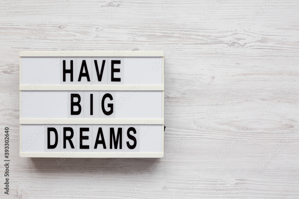 'Have Big Dreams' on a lightbox on a white wooden background, top view. Flat lay, overhead, from above. Copy space. 'Have Big Dreams' on a lightbox on a white wooden background, top view. Flat lay, overhead, from above. Copy space.