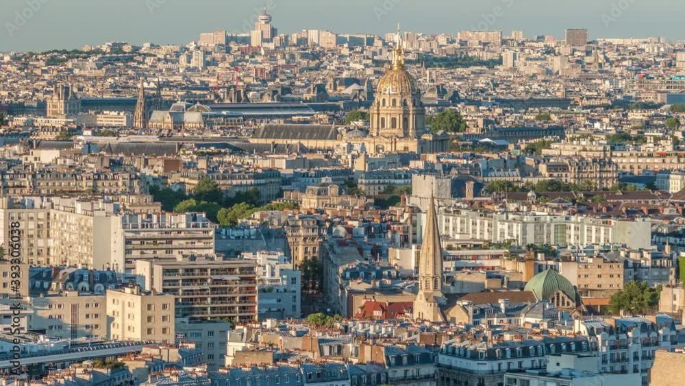 Aerial panorama above houses rooftops in a Paris timelapse. Evening view with les invalides and long shadows bebore sunset Aerial panorama above houses rooftops in a Paris timelapse. Evening view with les invalides and long shadows bebore sunset
