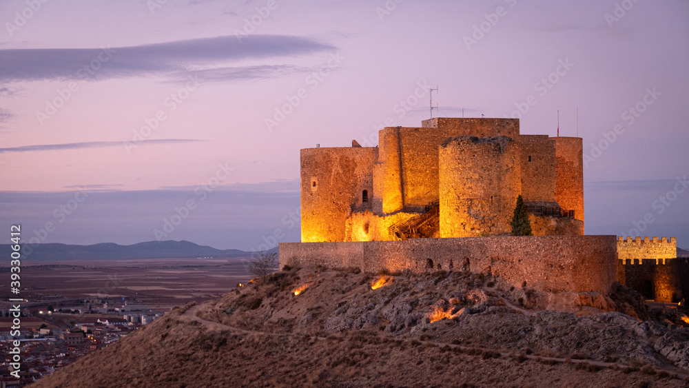 CONSUEGRA CASTLE LIGHTED AT SUNSET, SPAIN