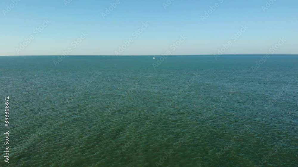 A yacht at the horizon on a nice sunny day. A yacht at the horizon on a nice sunny day.
