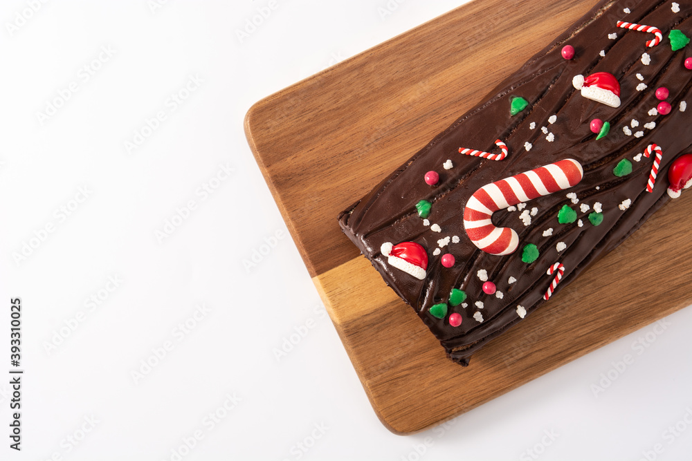 Chocolate yule log christmas cake isolated on white background.Top view. Copy space
