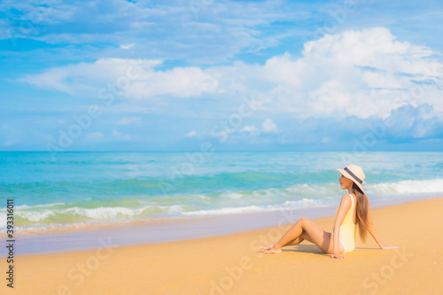 Portrait beautiful young asian woman relax smile leisure around outdoor sea beach ocean