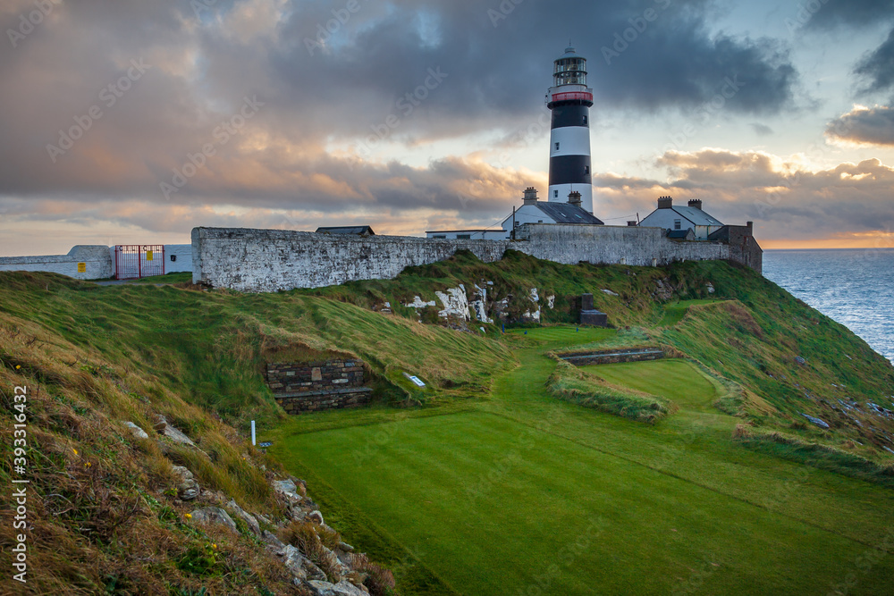 Fototapeta premium The 18th Tee Box At The Old Head Of Kinsale With The Lighthouse Looking On