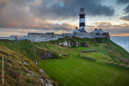 The 18th Tee Box At The Old Head Of Kinsale With The Lighthouse Looking On photo