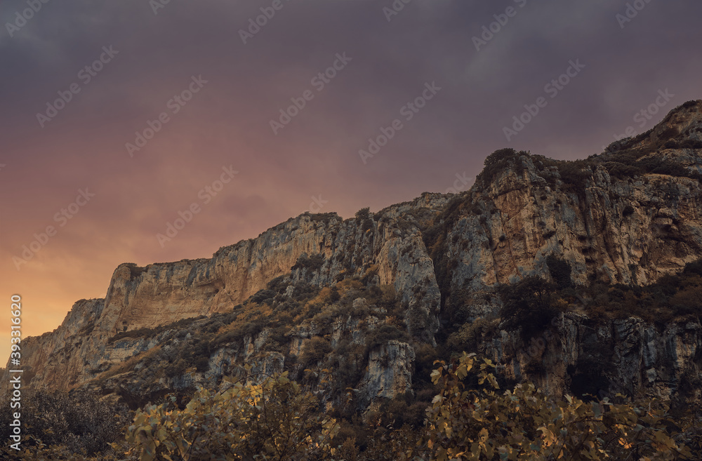 Canyon crossed by a river at sunset. Lumbier canyon next to the irati river at sunset Canyon crossed by a river at sunset. Lumbier canyon next to the irati river at sunset