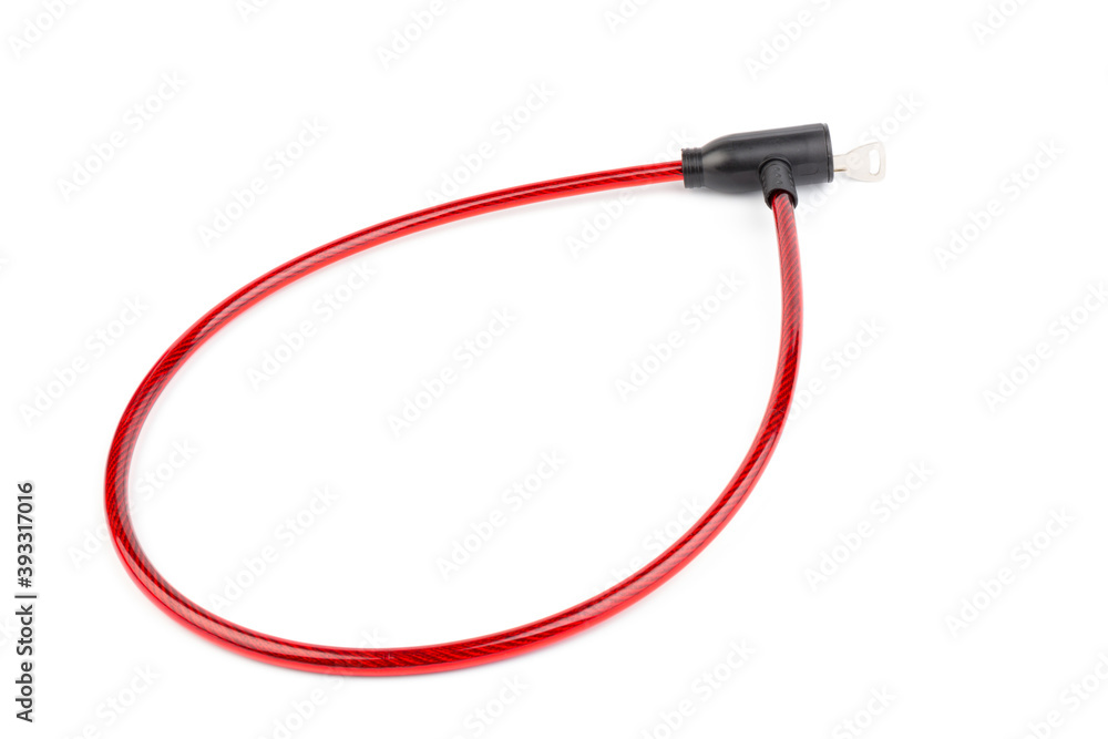 Fototapeta premium Flexible red bicycle cable with key on white background. Security and safety concept.