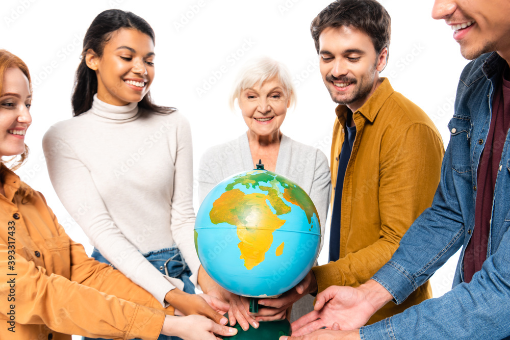 Smiling multicultural people holding globe isolated on white Smiling multicultural people holding globe isolated on white