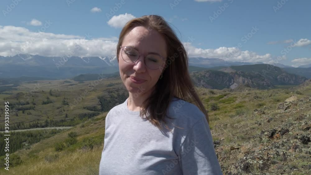 Happy woman in Altai mountains. Vacation, travel and adventure concept Happy woman in Altai mountains. Vacation, travel and adventure concept