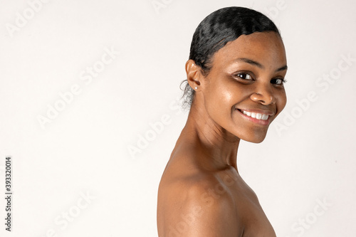 Cheerful bare chested black woman portrait