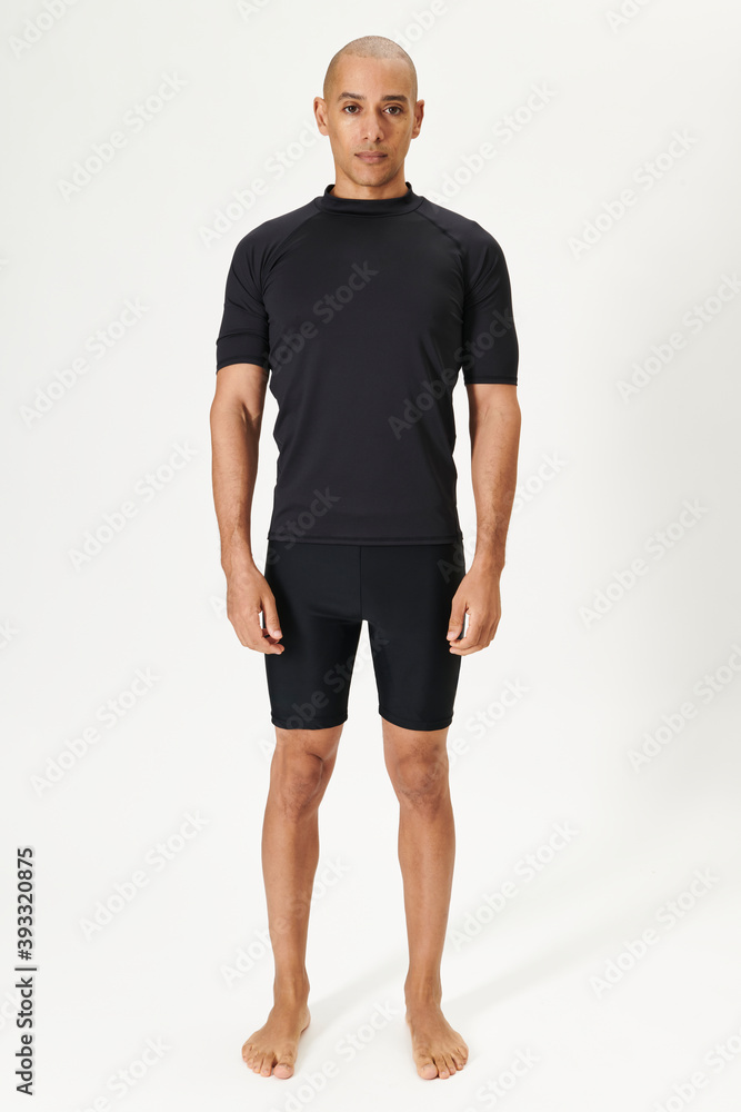 Fototapeta premium Men's black short sleeved wetsuit top full body shot