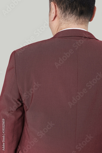 Size inclusive men's brown suit fashion studio shot