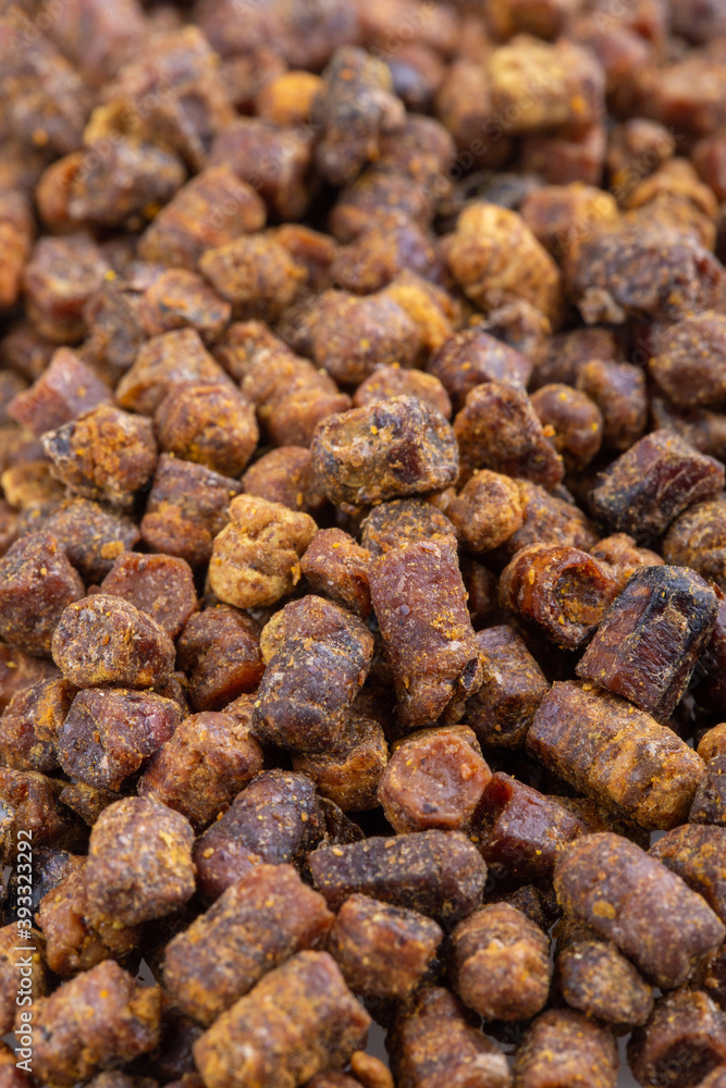 Heap of bee bread as background. Close-up.