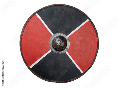 A round wooden shield with a metal boss in the centre. 
