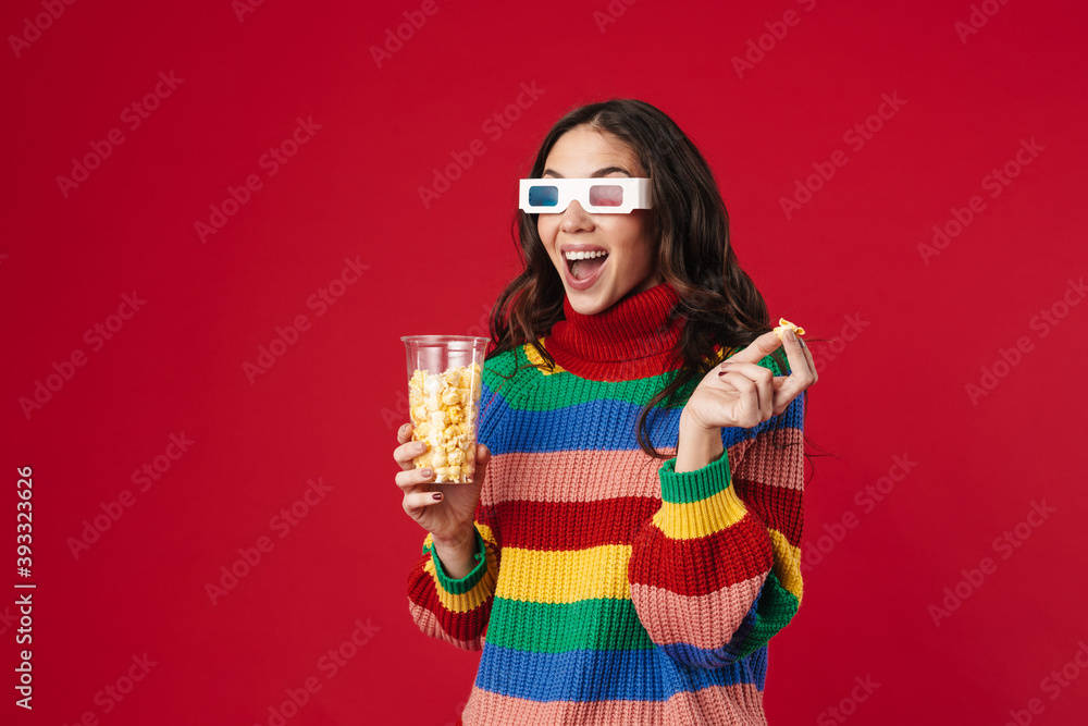 Excited beautiful girl eating popcorn and watching movie Excited beautiful girl eating popcorn and watching movie