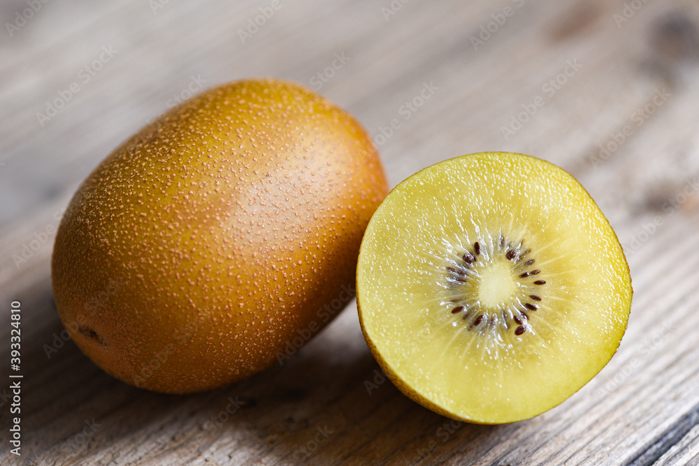 Fototapeta premium Kiwi slice on wooden background, kiwi fruit .