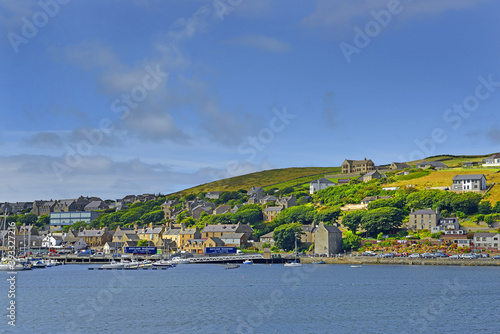 Waterfront and harbor of Stromness. Stromness locally is the second-most populated town in Orkney. It is in the southwestern part of Mainland Orkney. photo