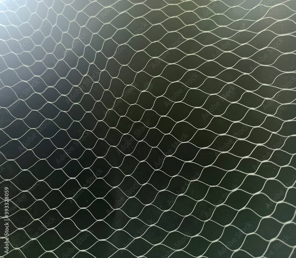 White mesh pattern on black background White mesh pattern on black background