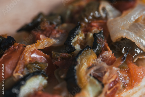 Homemade Mediterranean vegetables pizza tomato pepper onion. Texture. Macro lens.