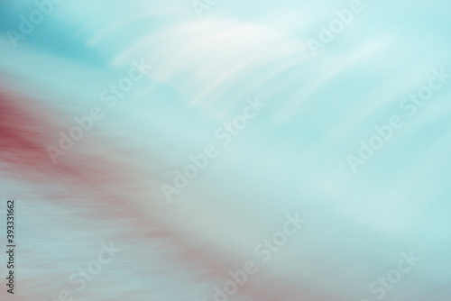 Abstract turquoise and red background, blurred motion