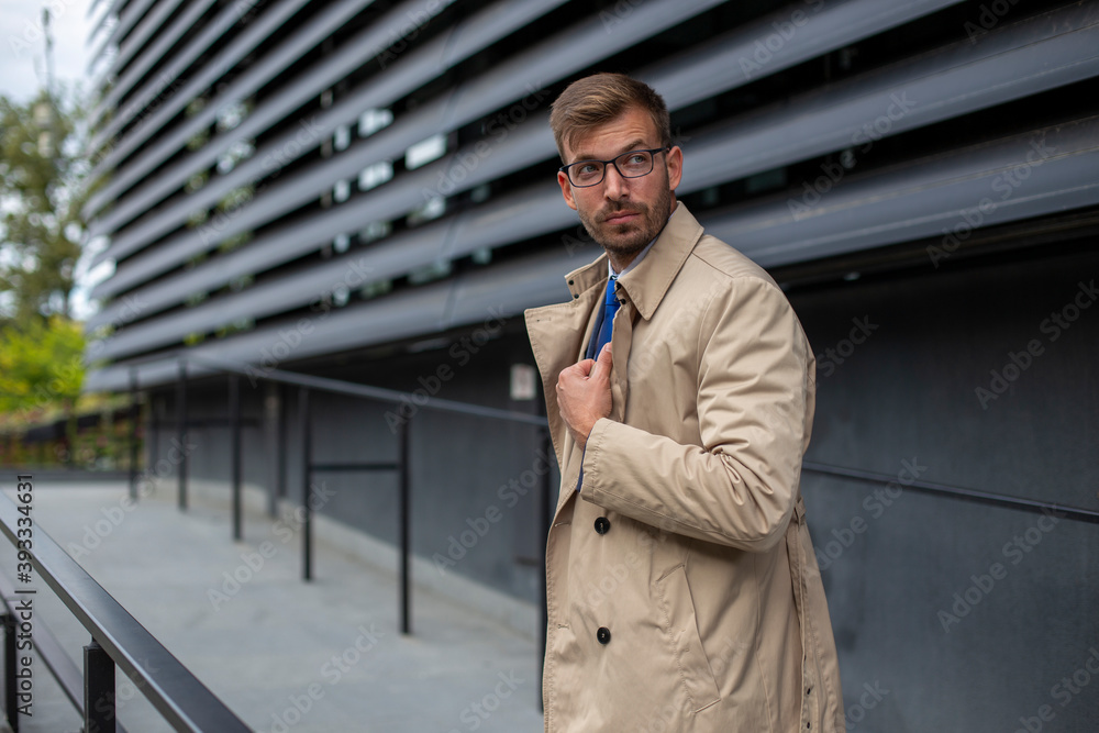Portrait of a businessman in front of the modern building. Portrait of a businessman in front of the modern building.