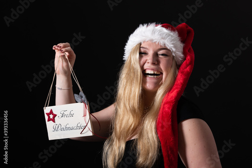 Junge Frauen freuen sich auf des Weihnachtsfest photo