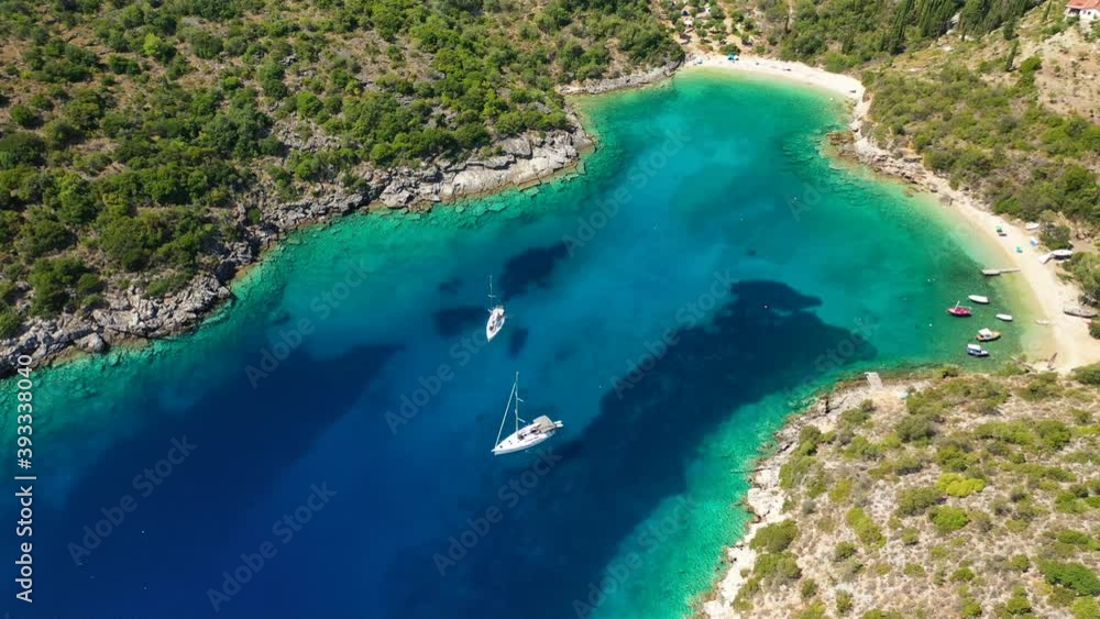 Aerial drone video of turquoise heart shaped paradise sandy beach and bay of Sarakiniko a safe sail boat anchorage in Ithaki or Ithaca island, Ionian, Greece Aerial drone video of turquoise heart shaped paradise sandy beach and bay of Sarakiniko a safe sail boat anchorage in Ithaki or Ithaca island, Ionian, Greece