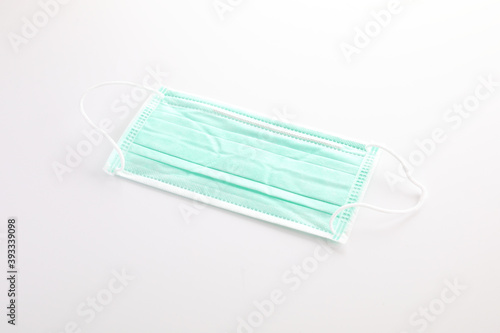 Used green mask isolated in white background