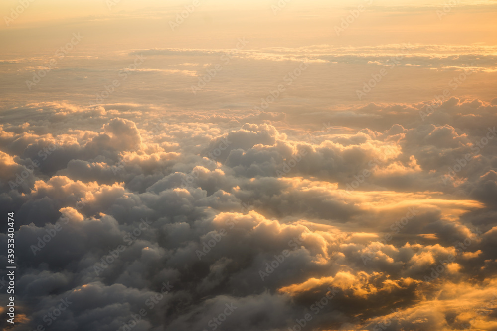 the golden light above the clouds at sunset