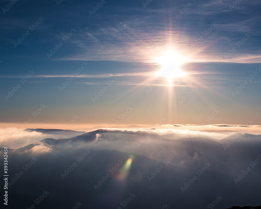 Beautiful light blue sky, beauty and Clouds at sunset in the mountain, the rays of the sun break through the clouds. Natural