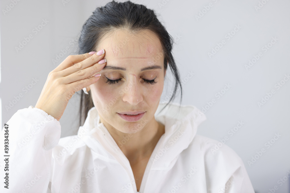Portrait of tired doctor after shift with coronavirus patients. What Doctors Fighting Coronavirus Go Through Concept Portrait of tired doctor after shift with coronavirus patients. What Doctors Fighting Coronavirus Go Through Concept