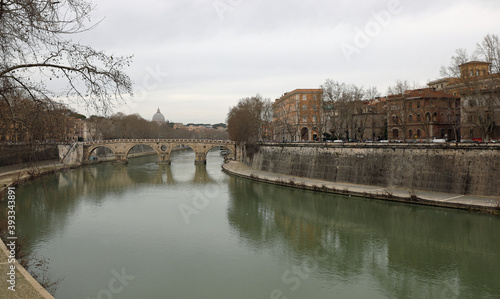 river Tiber that crosses the city of Rome is at the bottom of th photo