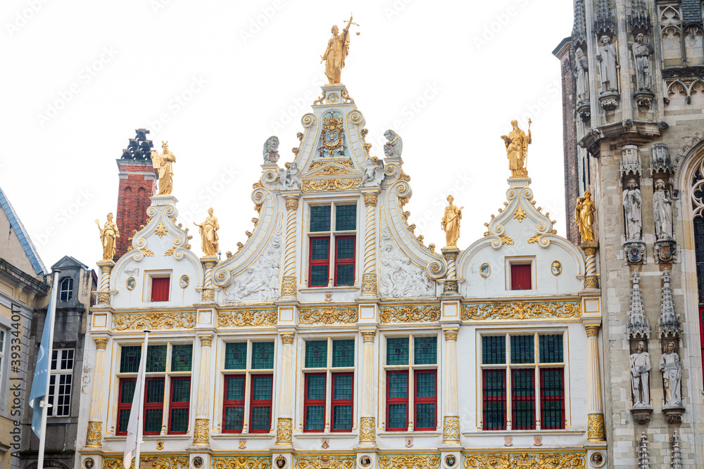 BRUGES, BELGIUM - April 13, 2018: Antique building view in Old Town Bruges, Belgium