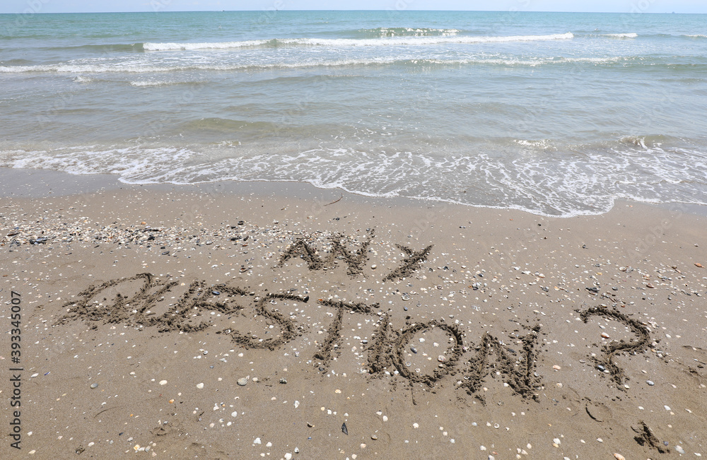 text any question written in the sand of the beach by the sea text any question written in the sand of the beach by the sea