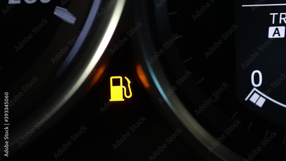 Empty fuel warning light in car dashboard. Fuel pump icon. gasoline