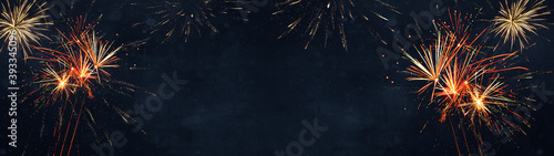 Silvester / New Year / Party background banner panorama long- firework on rustic dark black blue texture, with space for text 