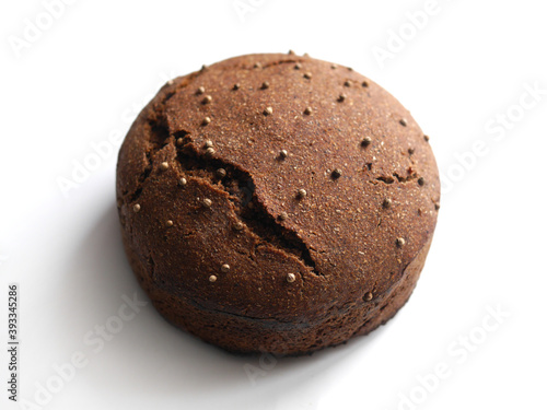 Homemade rye round bread with coriander isolated on white background