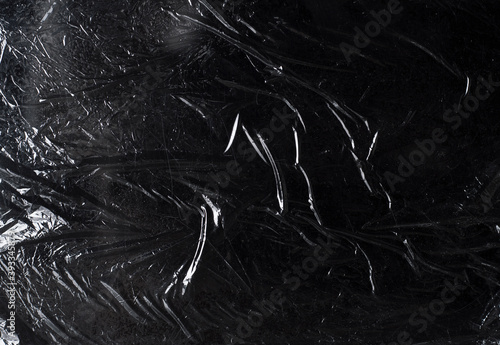 texture of dark crumpled polyethylene background